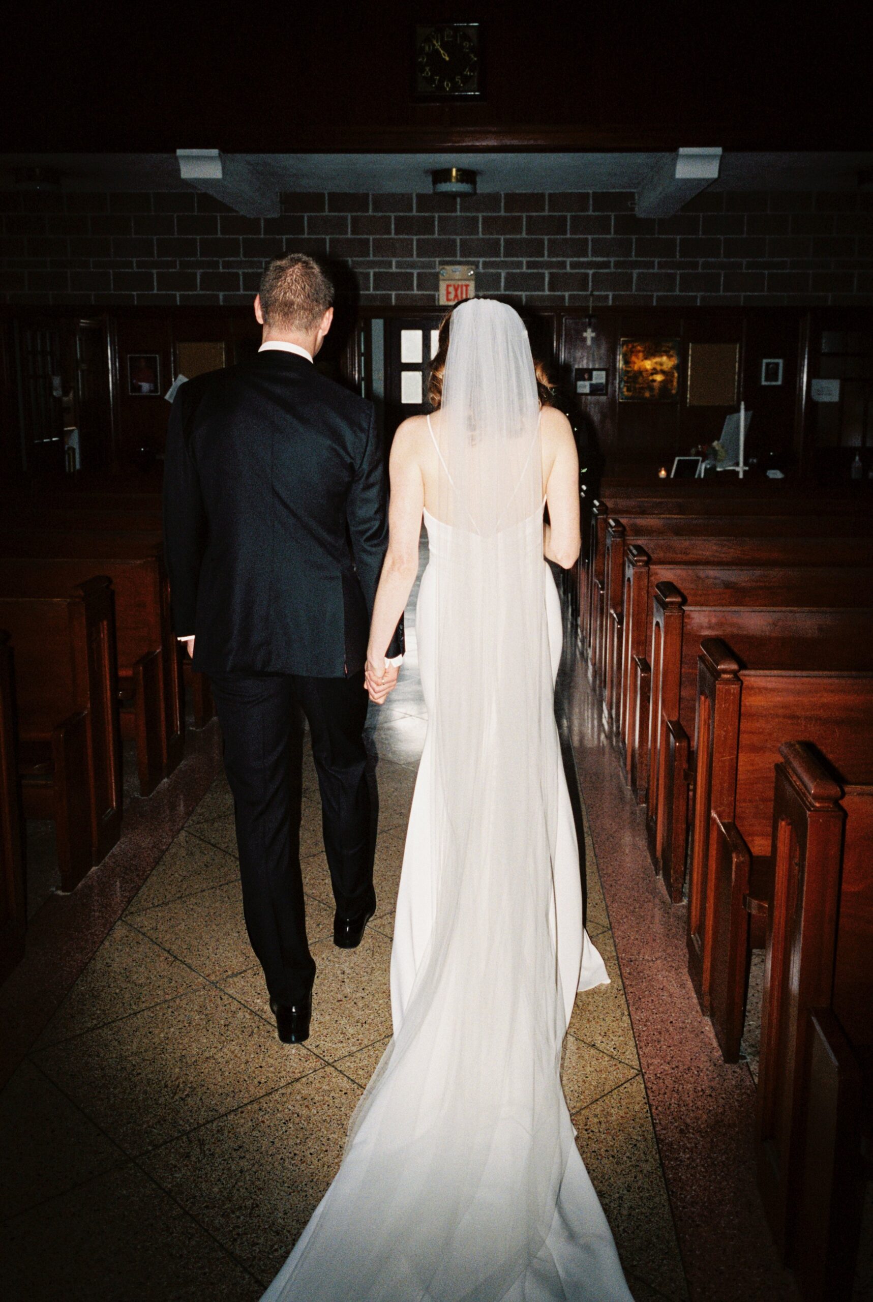 Flash photography film photo of bride and groom leaving church