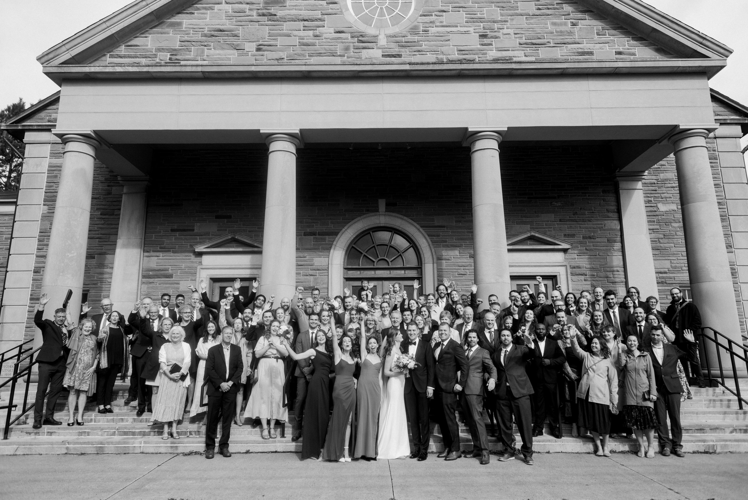 Wedding guests on stairs at Saint Thomas Aquinas Church in Halifax, Nova Scotia
