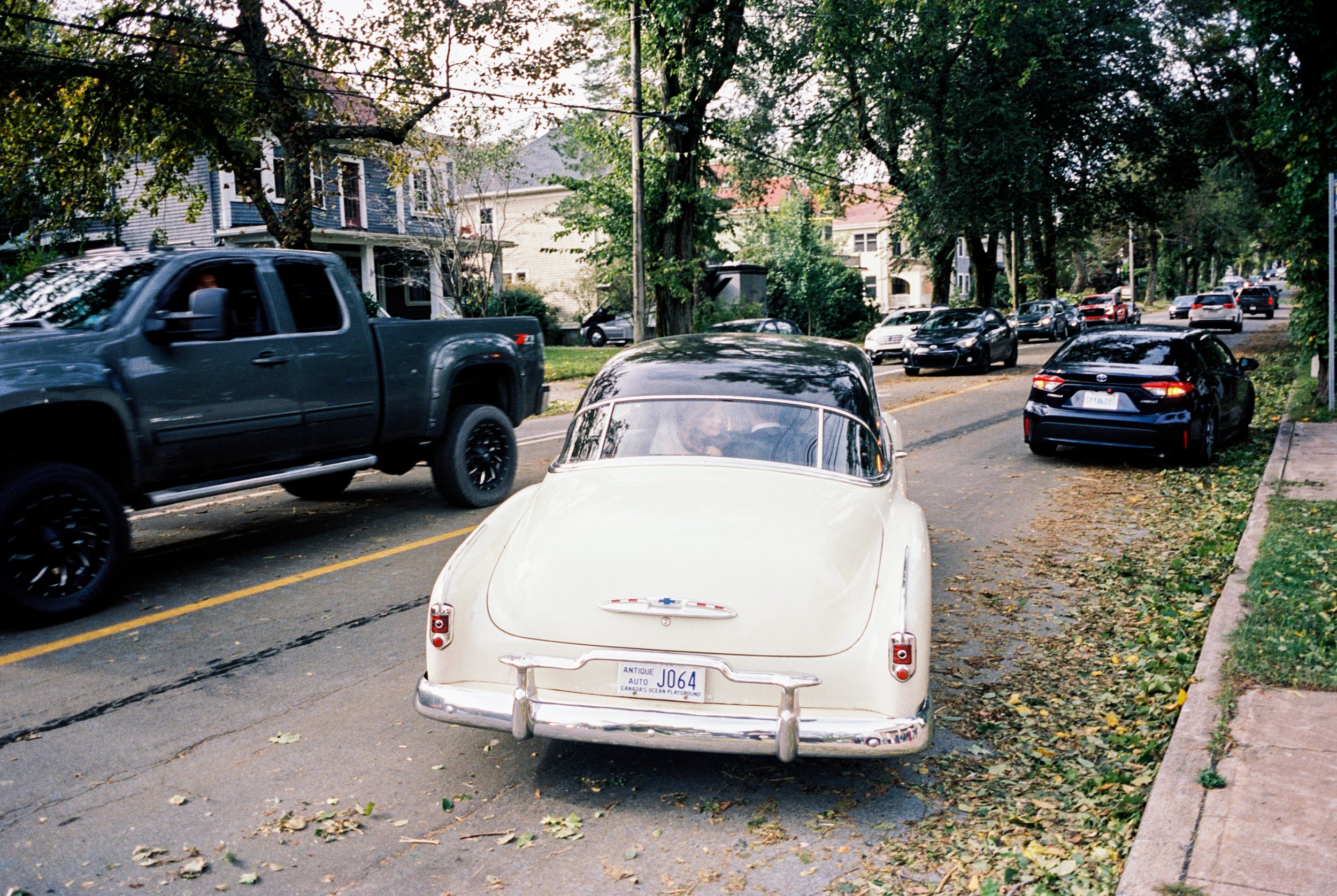 Bride and groom leaving in vintage car in Halifax Nova Scotia