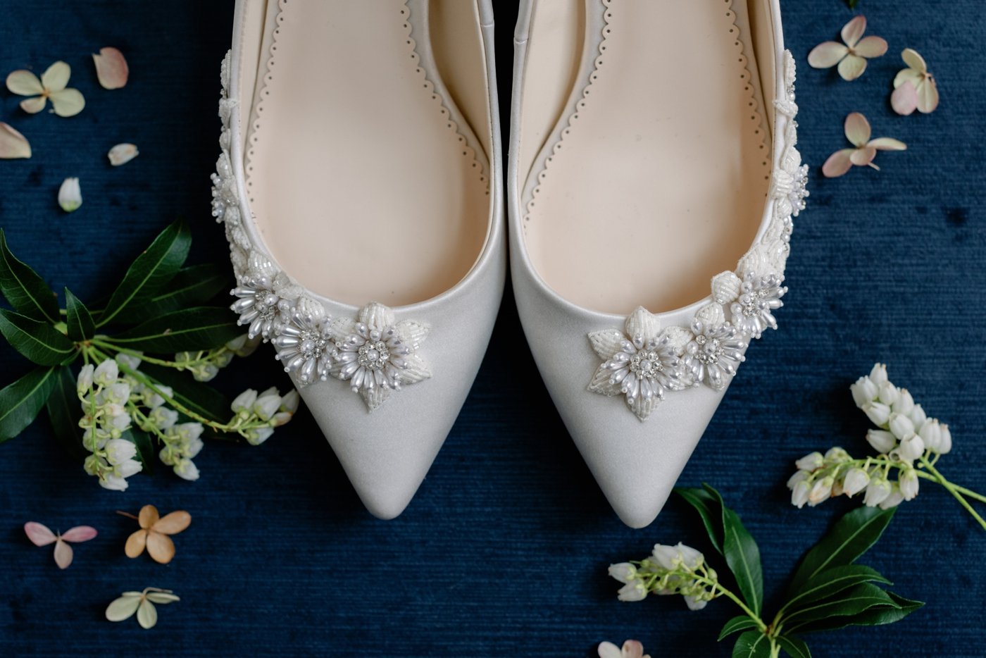 Pointed toe silver bridal shoes with crystal flower details from Bella Belle