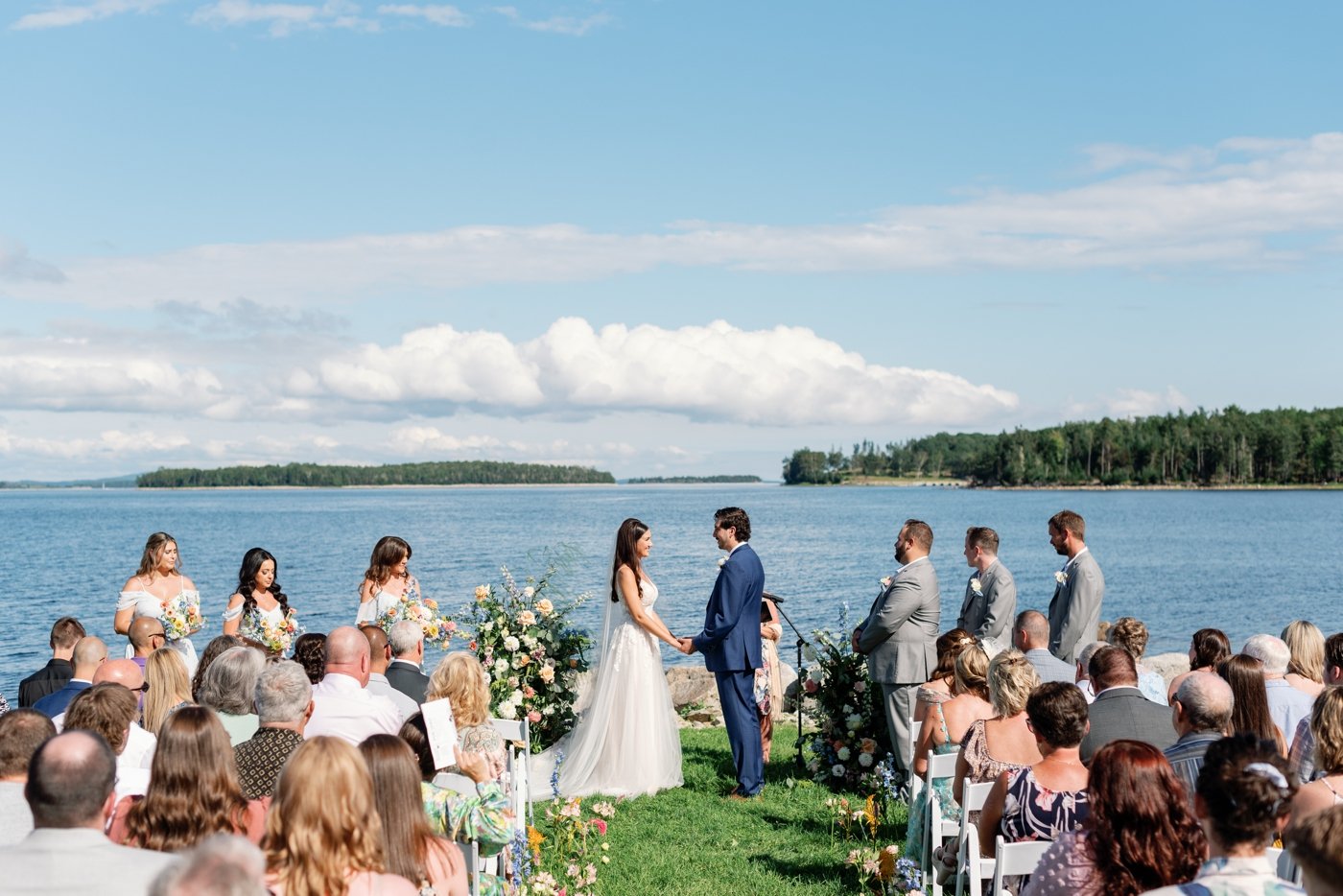 Outdoor waterfront wedding ceremony at Oak Island Resort
