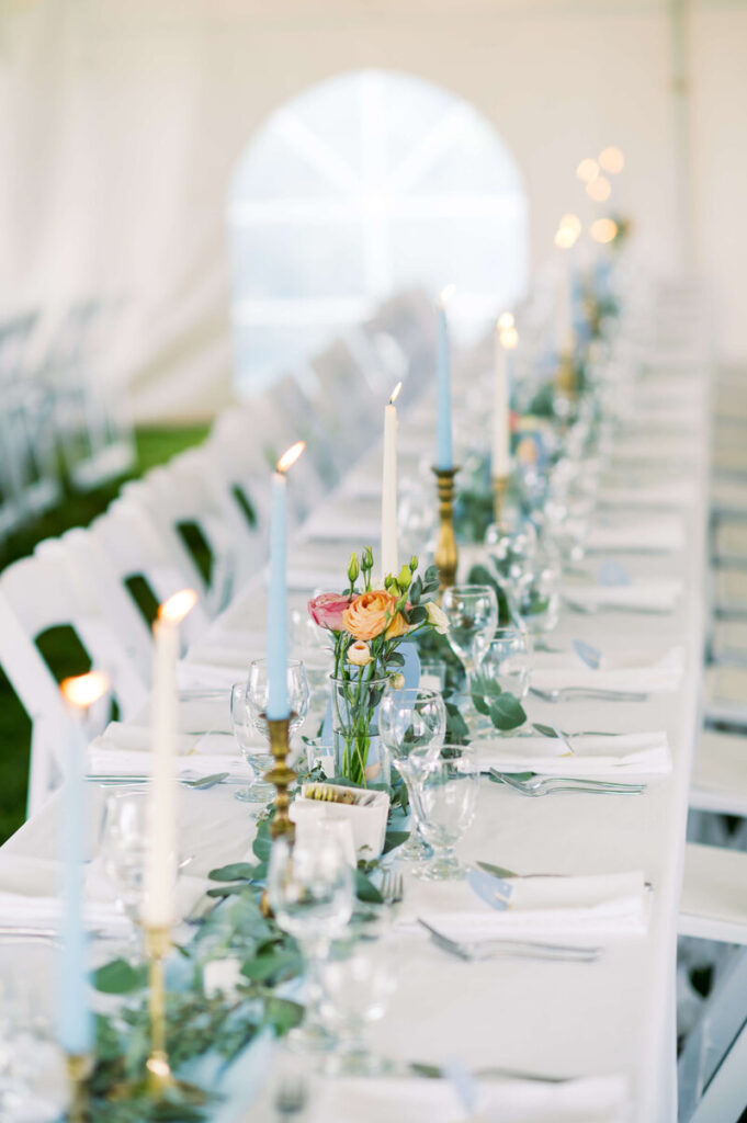 Elegant outdoor wedding table with candles and florals showing the best time of year to get married in Nova Scotia.